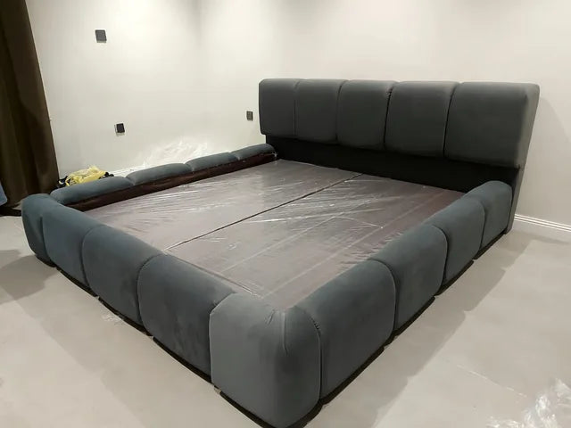 A customer’s grey upholstered bed after installation