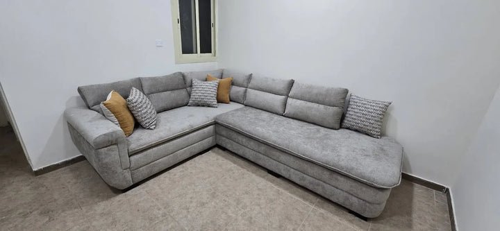 Complete light-grey corner sofa with coordinated cushion styling in Jeddah
