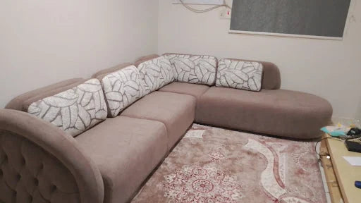 A compact corner with patterned cushions — KLIK customer-home photograph