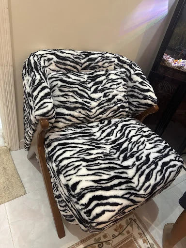 An accent chair with a bold pattern — KLIK customer-home photograph
