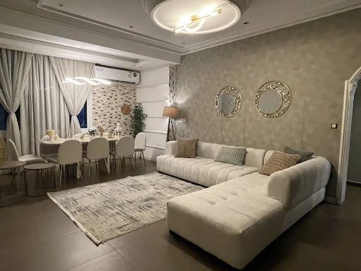 A light corner sofa in an open living space — KLIK customer-home photograph