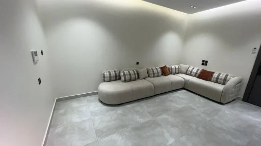 A light corner sofa in a spacious room — KLIK customer-home photograph