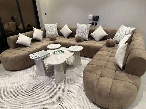Tufted corner seating around small tables — KLIK customer-home photograph