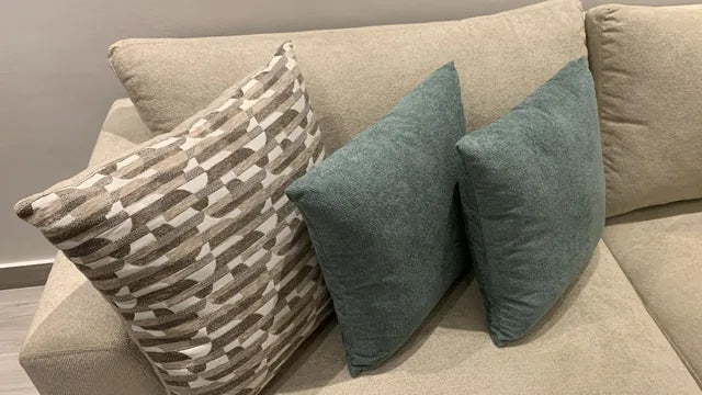 Patterned and plain cushions together — KLIK customer-home photograph