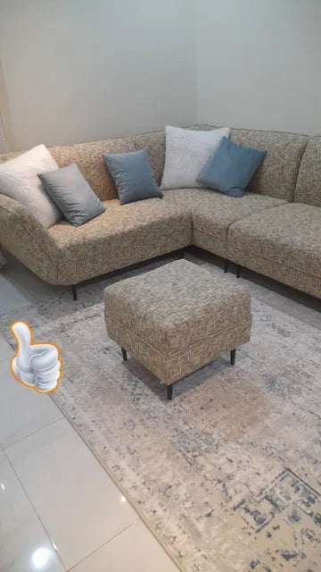 A corner sofa with a matching pouf — KLIK customer-home photograph