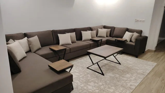 Brown majlis seating with light cushions — KLIK customer-home photograph