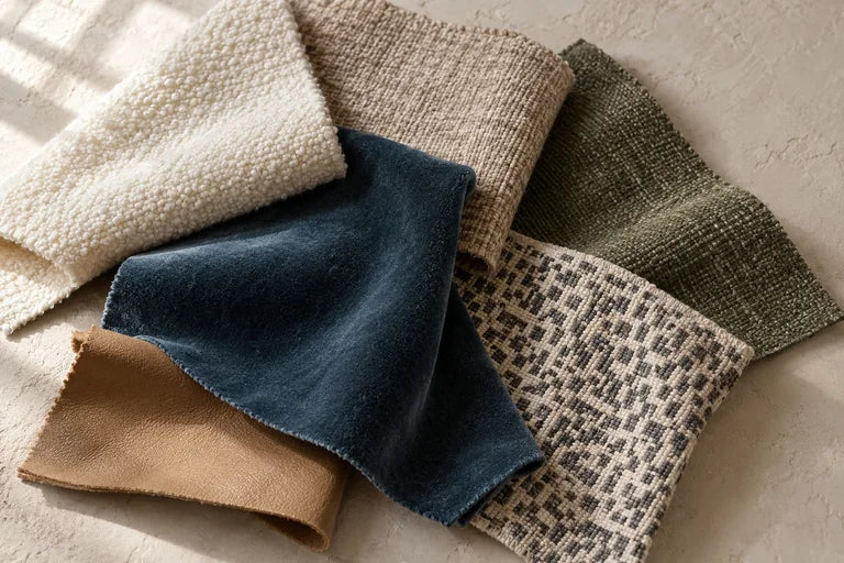 Layered upholstery textures in ivory, slate, olive and warm camel